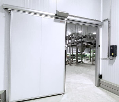 Industrial sliding door in busy industrial environment